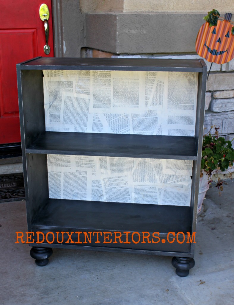 Bookshelf backed with bookpages redouxinteriors