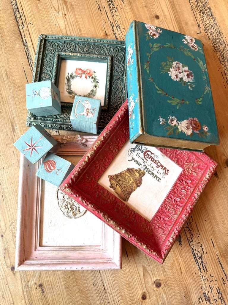 Holiday upcycled décor by Karen Berg of Redoux Interiors using DIY Paint and Iron Orchid Designs (IOD) — vintage frames, wood blocks, and painted book transformed into handmade Christmas gifts.