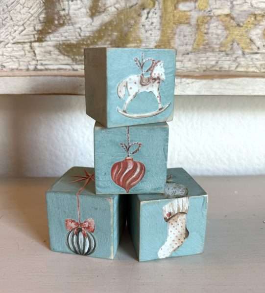 Hand-painted holiday wood blocks by Karen Berg of Redoux Interiors using DIY Paint and Iron Orchid Designs (IOD) transfers — charming handmade Christmas gift idea.